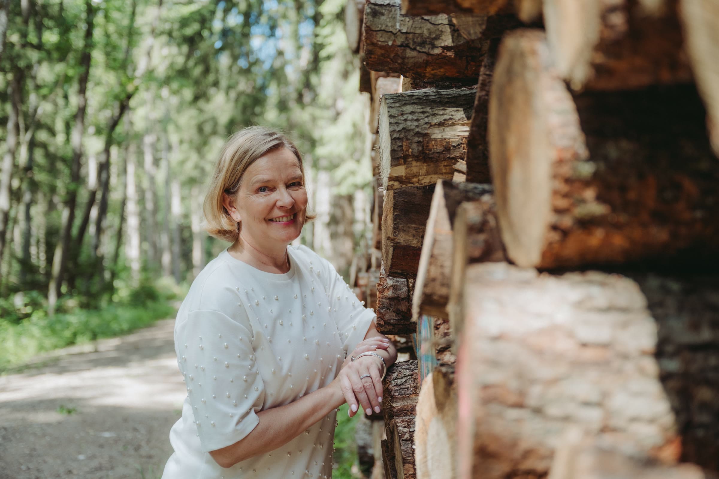 A forestry specialist inspecting timber in the forest