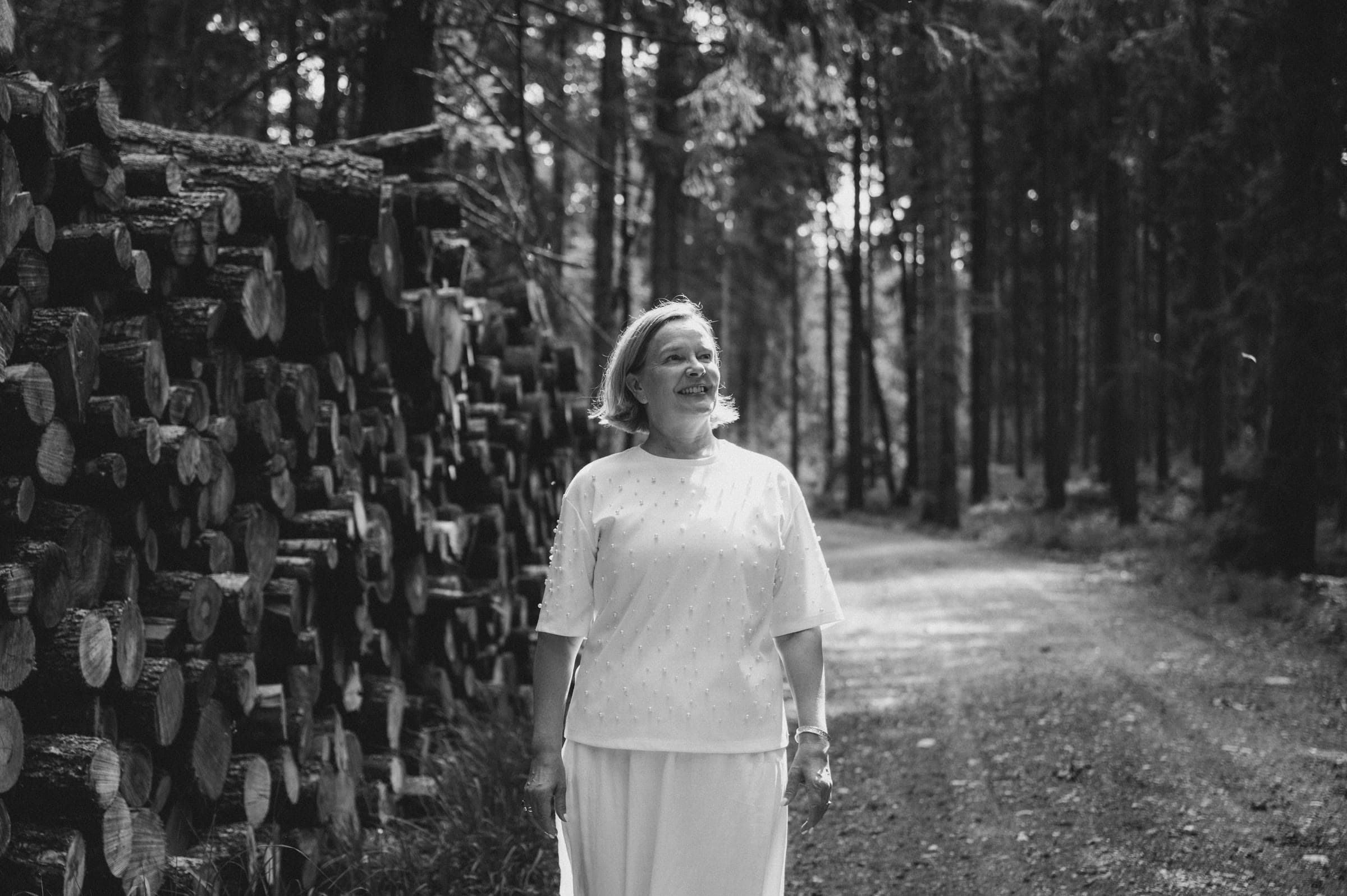 A person walking along a quiet forest path